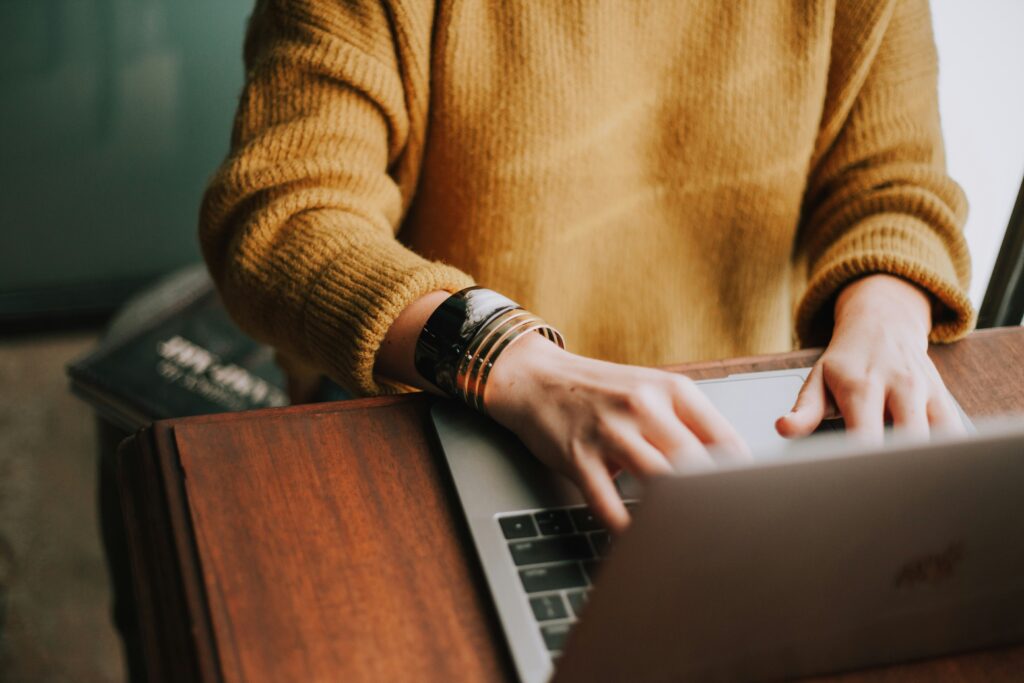 Lawyer using AI-powered marketing tools on laptop for law firm growth