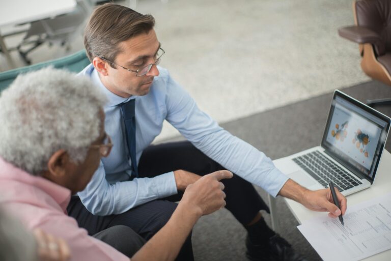 Criminal defense attorney reviewing SEO content funnel strategy on a laptop with case documents