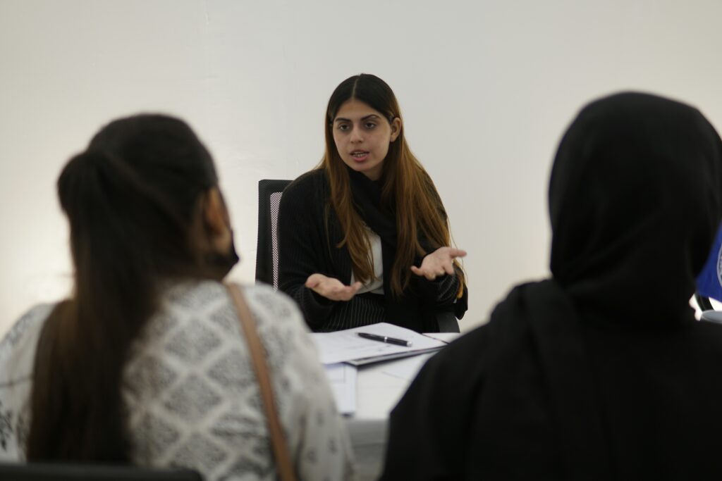Law firm receptionist using a structured intake script during a client phone consultation