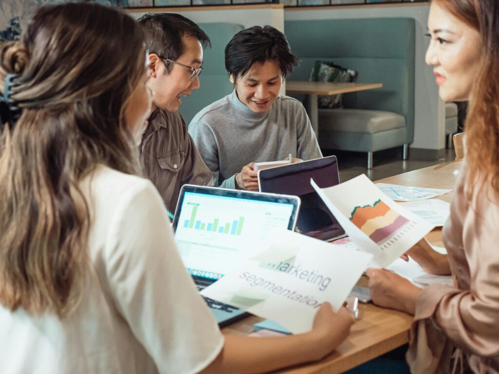 Law firm marketing team analyzing digital strategy dashboard showing declining ROI from outdated tactics